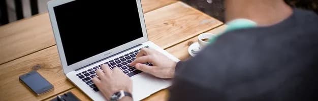 A laptop on a desk showing a case record