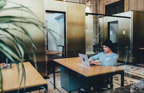 A professional reviewing a case at a bright desk