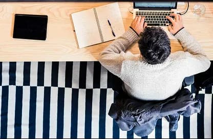 A reviewer working through documents at a desk