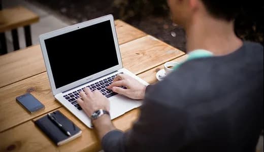 A laptop on a desk showing an engagement record