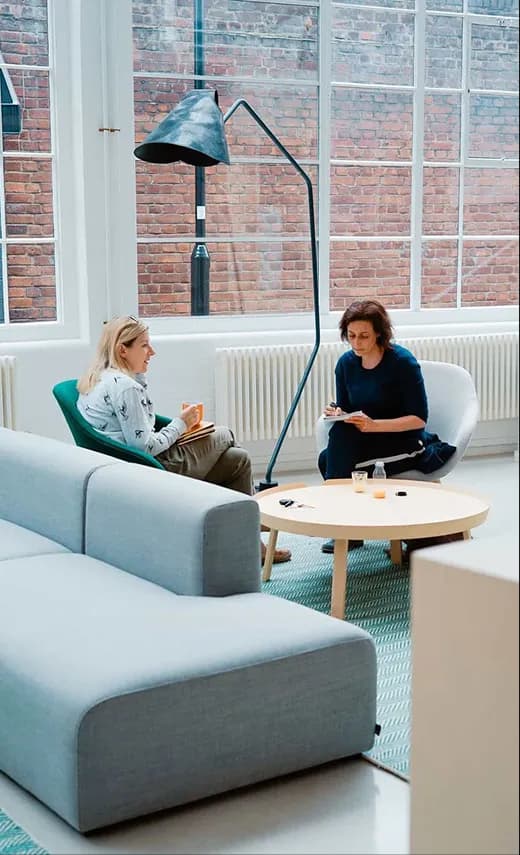 A professional reviewing payment terms in a lounge area