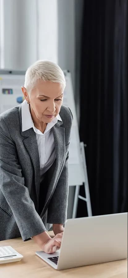 A buyer checking funding status on her laptop