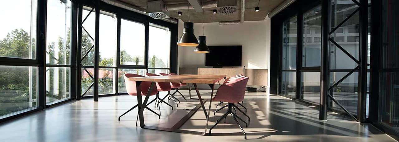 An open-plan office with teams working across markets