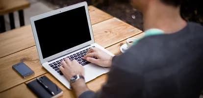 A payment record open on a laptop
