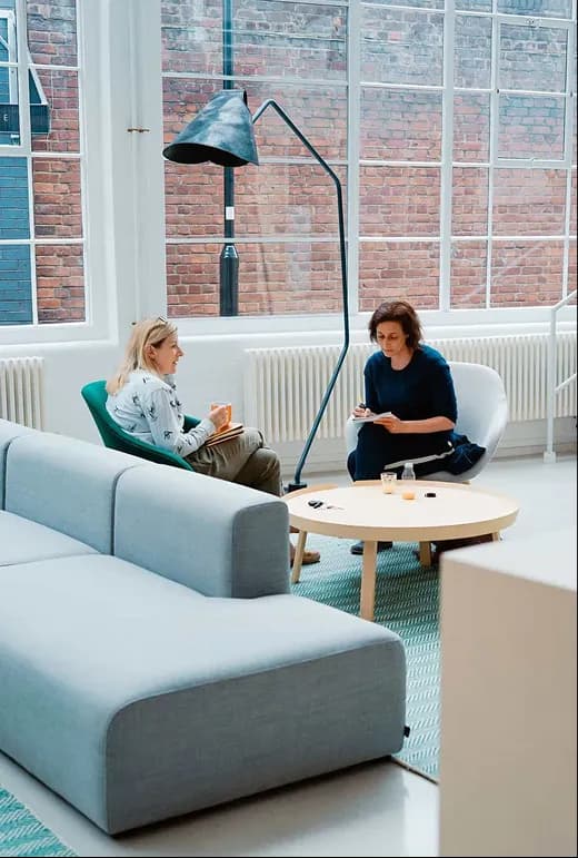 A professional reviewing payment terms in a lounge