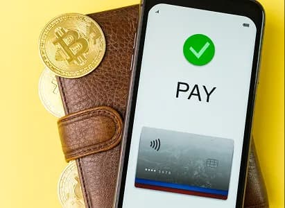 A phone payment confirmation beside a wallet